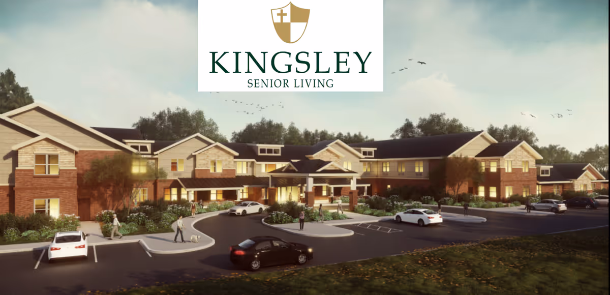 Exterior view of Kingsley Senior Living facility showing a large two-story building with brick and light-colored siding, surrounded by landscaped greenery and a parking lot with several cars. People are walking near the entrance and around the parking area under a clear sky with birds flying.