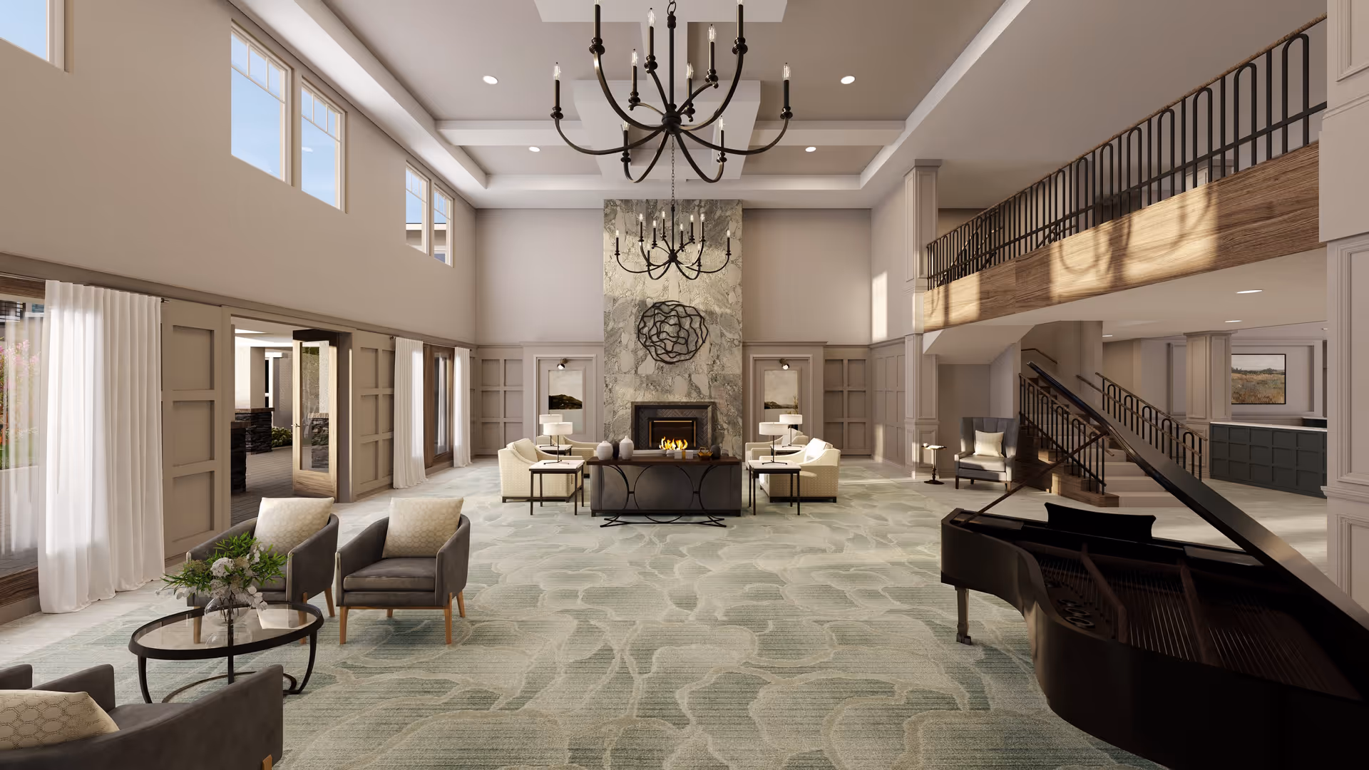 Spacious and elegant senior living facility common area with high ceilings, large windows, a grand chandelier, a stone fireplace, comfortable seating arrangements, and a grand piano near a staircase leading to an upper level balcony.
