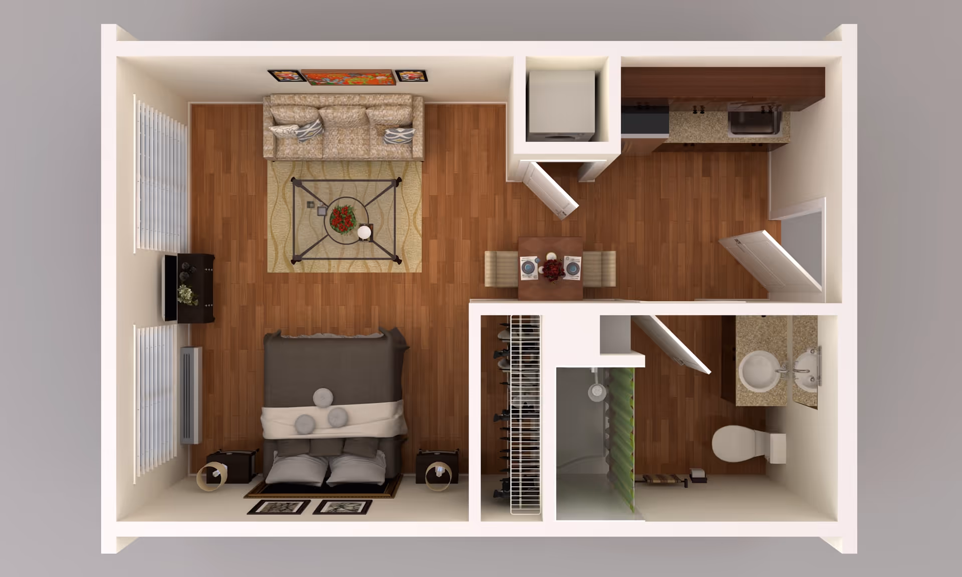Top-down view of a senior living apartment floor plan showing a combined living and bedroom area with a sofa, coffee table, TV, and bed. Adjacent to this is a small dining area with a table and two chairs, a kitchen with appliances and cabinetry, and a bathroom with a shower, toilet, and sink.