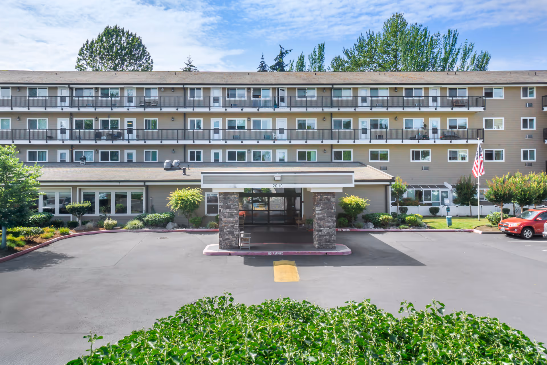 Exterior view of Brookdale Allenmore IL senior living building with a covered entrance.