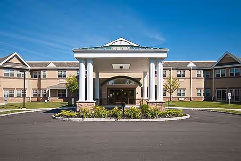 Exterior view of Foothill Acres Rehabilitation and Nursing Center with circular driveway and landscaping