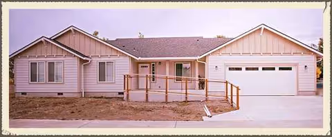 Front view of a single-story, ranch-style senior care facility with a ramp and driveway.