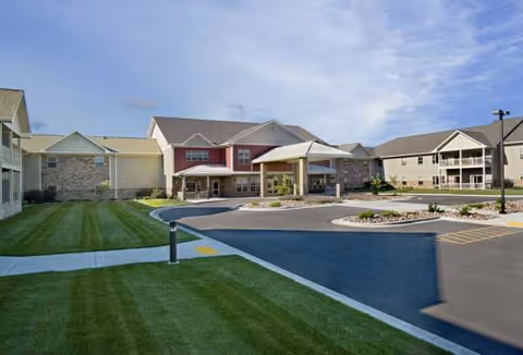 Front exterior view of Primrose Retirement Community of Wausau with entry and landscaping.