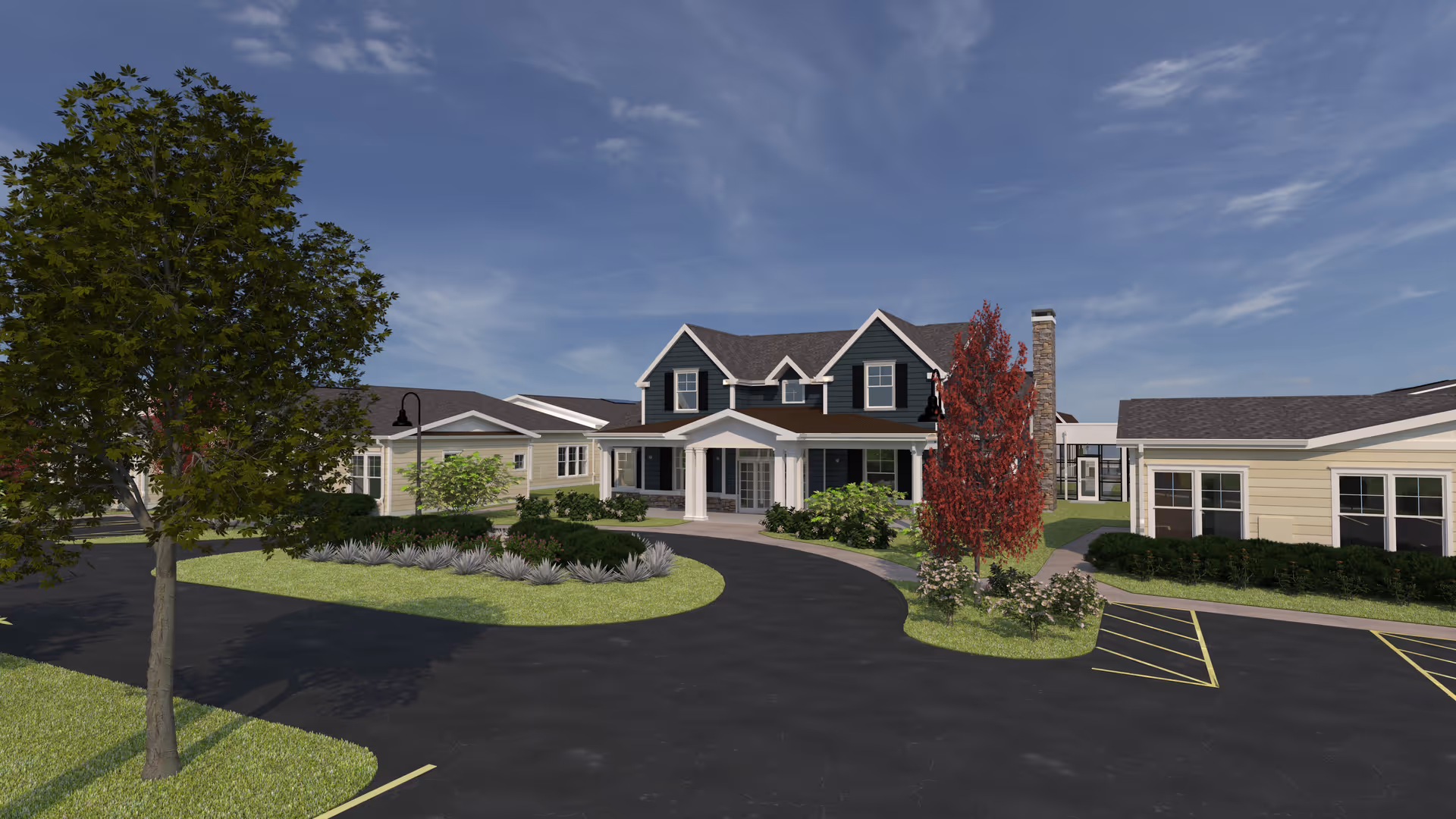 Front exterior of a senior living building with a circular driveway, landscaped islands, and a covered main entrance.