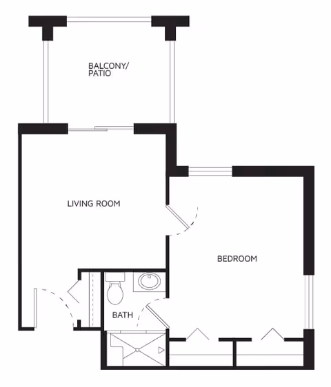 Floor plan of a living space showing a balcony/patio, living room, bedroom, and a bathroom with a shower, toilet, and sink.