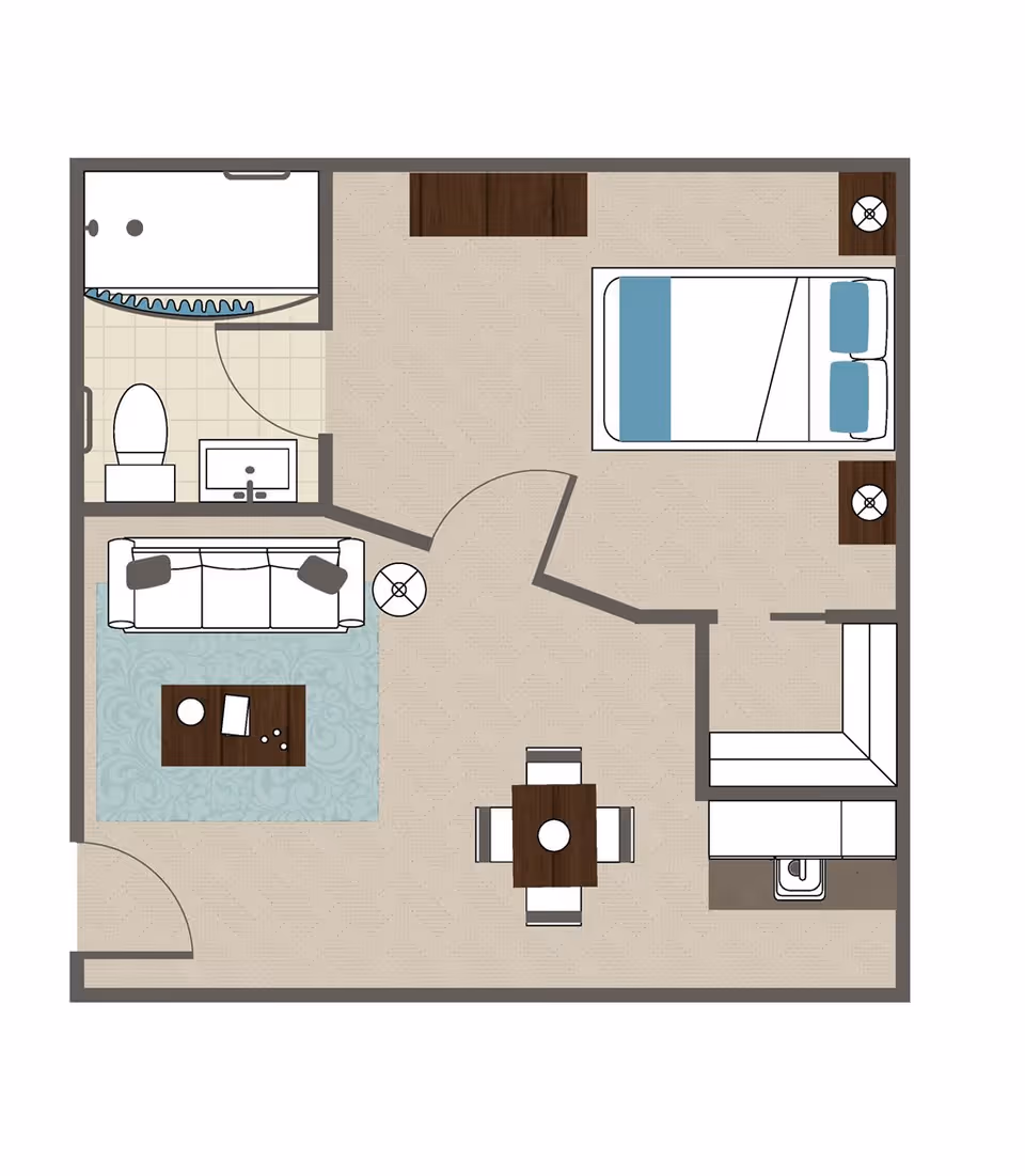 Floor plan of a living space showing a bedroom with a bed and two nightstands, a bathroom with a toilet, sink, and shower, a living room area with a sofa, coffee table, and side table, a dining area with a table and four chairs, and a kitchen area with a sink and cabinets.