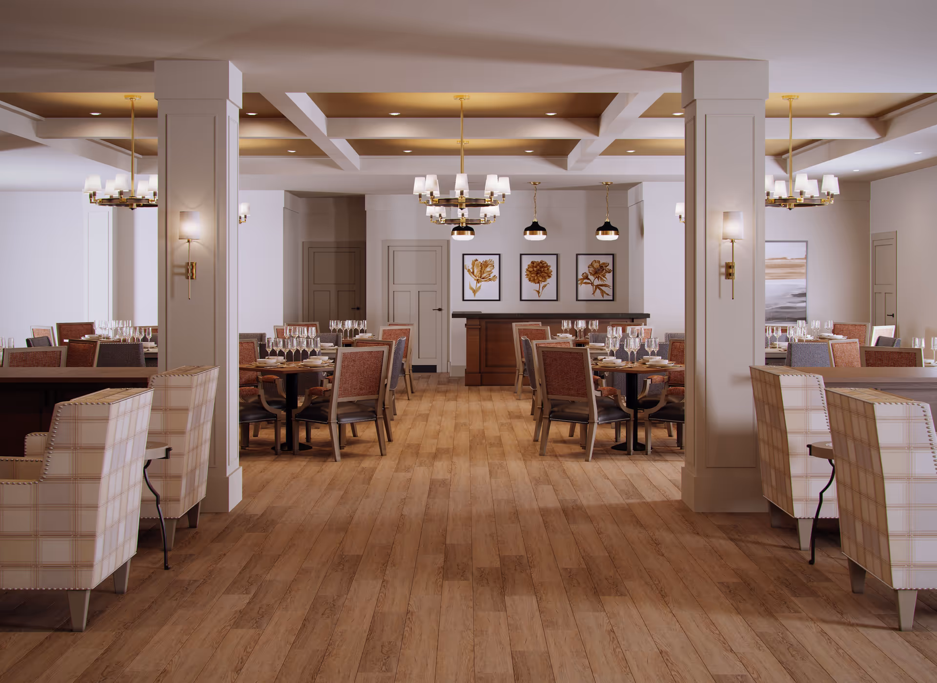 A spacious dining room with wooden flooring, multiple tables set with glassware and plates, upholstered chairs in plaid and solid patterns, decorative wall art featuring floral prints, and elegant ceiling lighting fixtures including chandeliers and pendant lights.