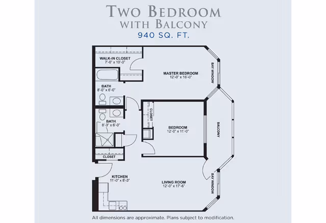 Floor plan of a two-bedroom apartment with a balcony, totaling 940 square feet. The layout includes a master bedroom with a walk-in closet and bay window, a second bedroom with a closet, two bathrooms, a kitchen, and a living room with bay windows and access to the balcony.
