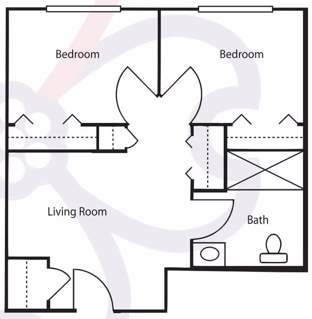 Floor plan showing a layout with two bedrooms, a living room, and a bathroom. The living room is centrally located with two bedrooms adjacent to it. The bathroom is positioned near one of the bedrooms and includes a toilet and sink.