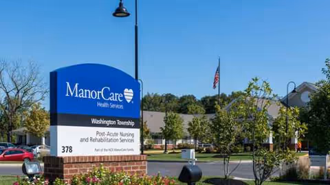 Exterior view of ManorCare Health Services Washington Township with a front sign.