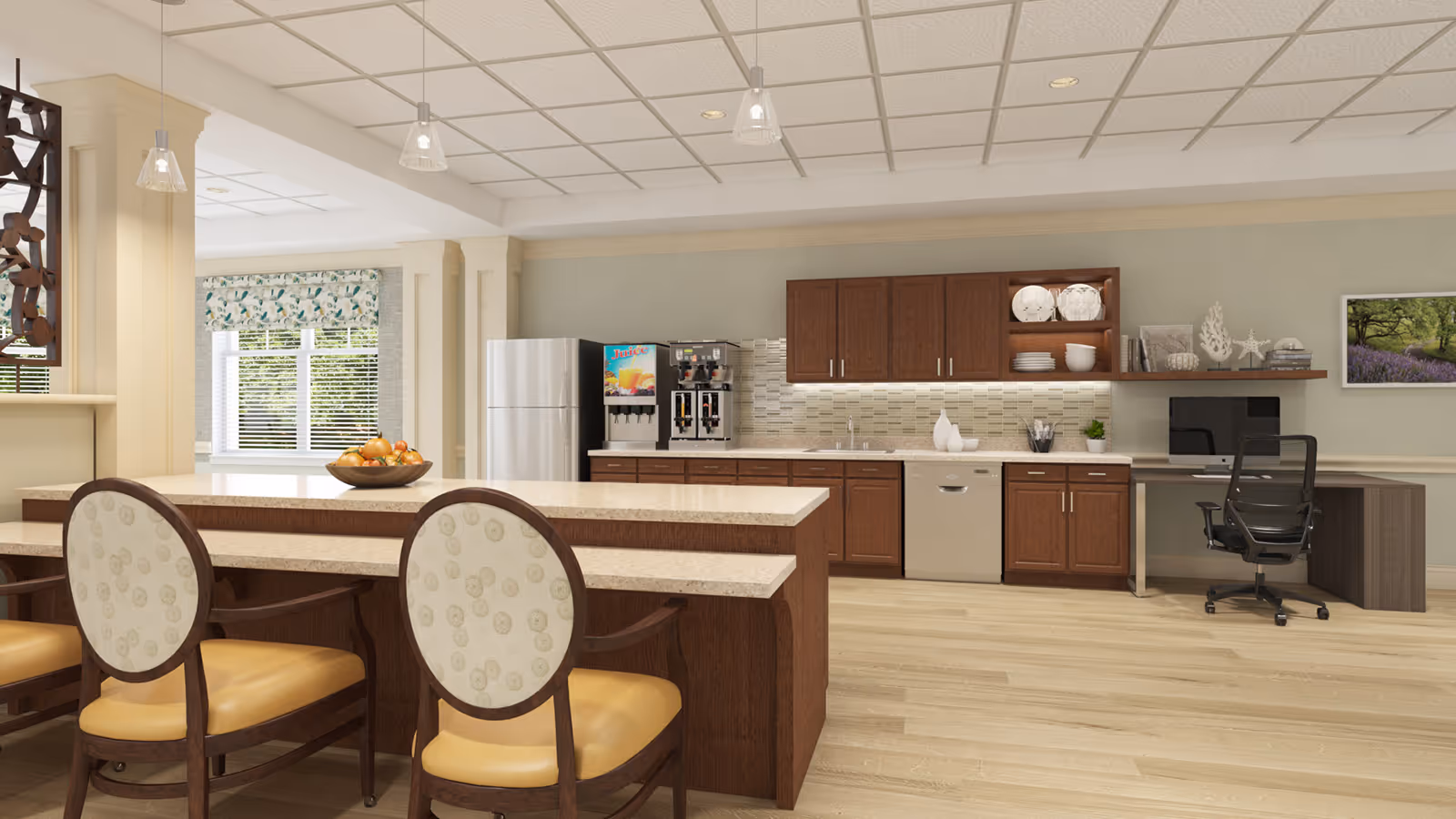 Open communal kitchen with a large island and seating, wooden cabinets, stainless appliances and a small desk area.