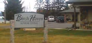 Birch Haven Senior Living sign in front of a building and parking area