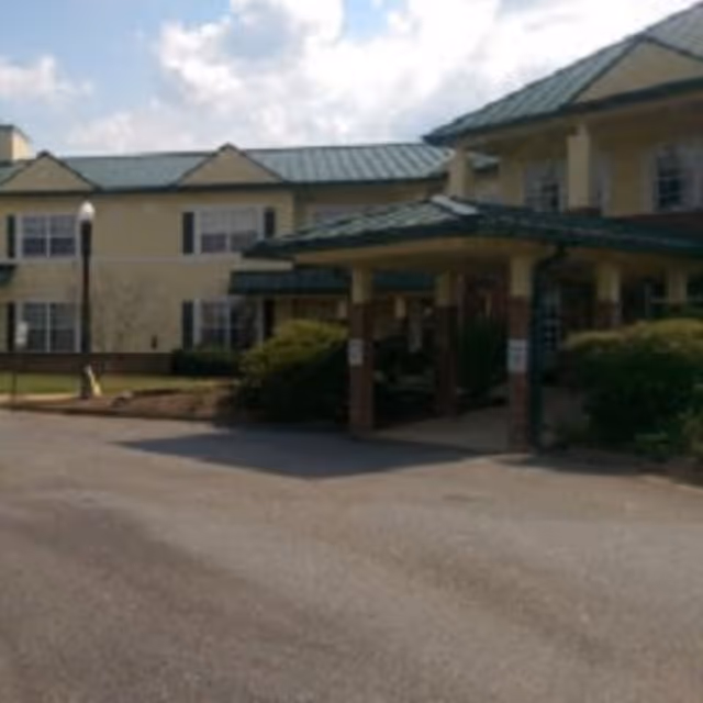 Exterior view of The Haven at Columbus entrance with a covered drop-off and parking.