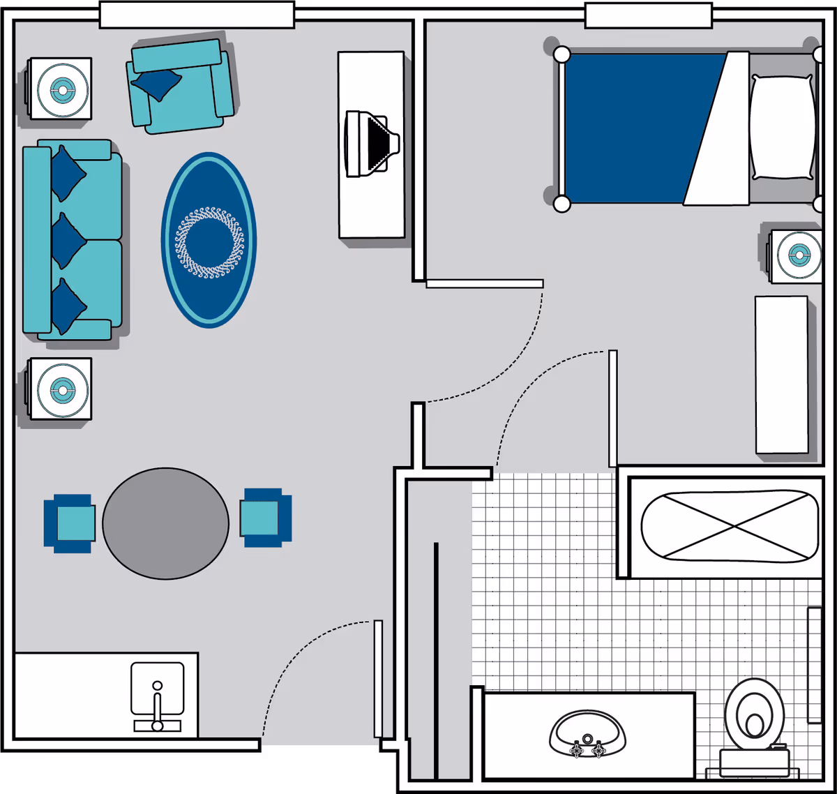 Floor plan of a living space showing a living room with a sofa, armchair, two side tables, an oval rug, and a round dining table with two chairs. Adjacent to the living room is a bedroom with a bed, nightstand, and dresser. Next to the bedroom is a bathroom with a bathtub, sink, and toilet. The layout includes doors connecting the rooms and a small kitchen area with a sink.