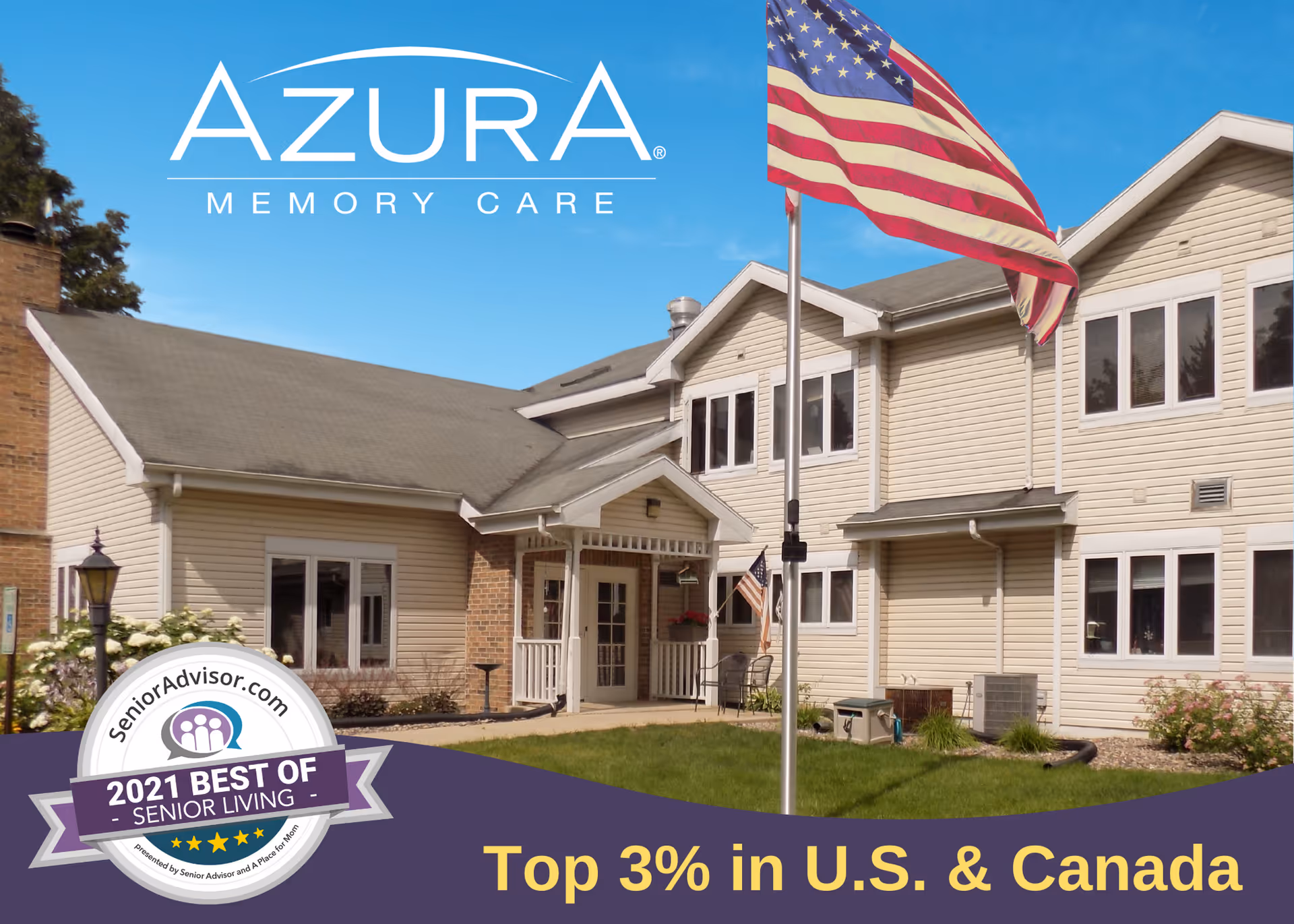 Exterior view of Azura Memory Care of Stoughton building with beige siding, multiple windows, an American flag on a flagpole in the front lawn, and a clear blue sky.