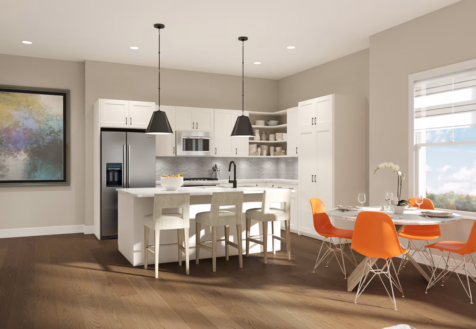 Bright open kitchen with a central island, pendant lights, stainless steel appliances, and a dining table with orange chairs by a window.