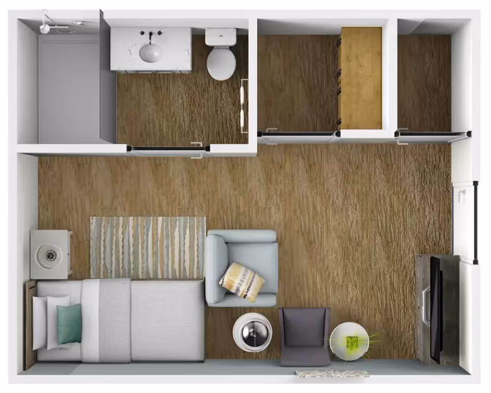 Top-down floor plan of a studio apartment with a bed, seating area, TV, bathroom, closets and wood flooring.