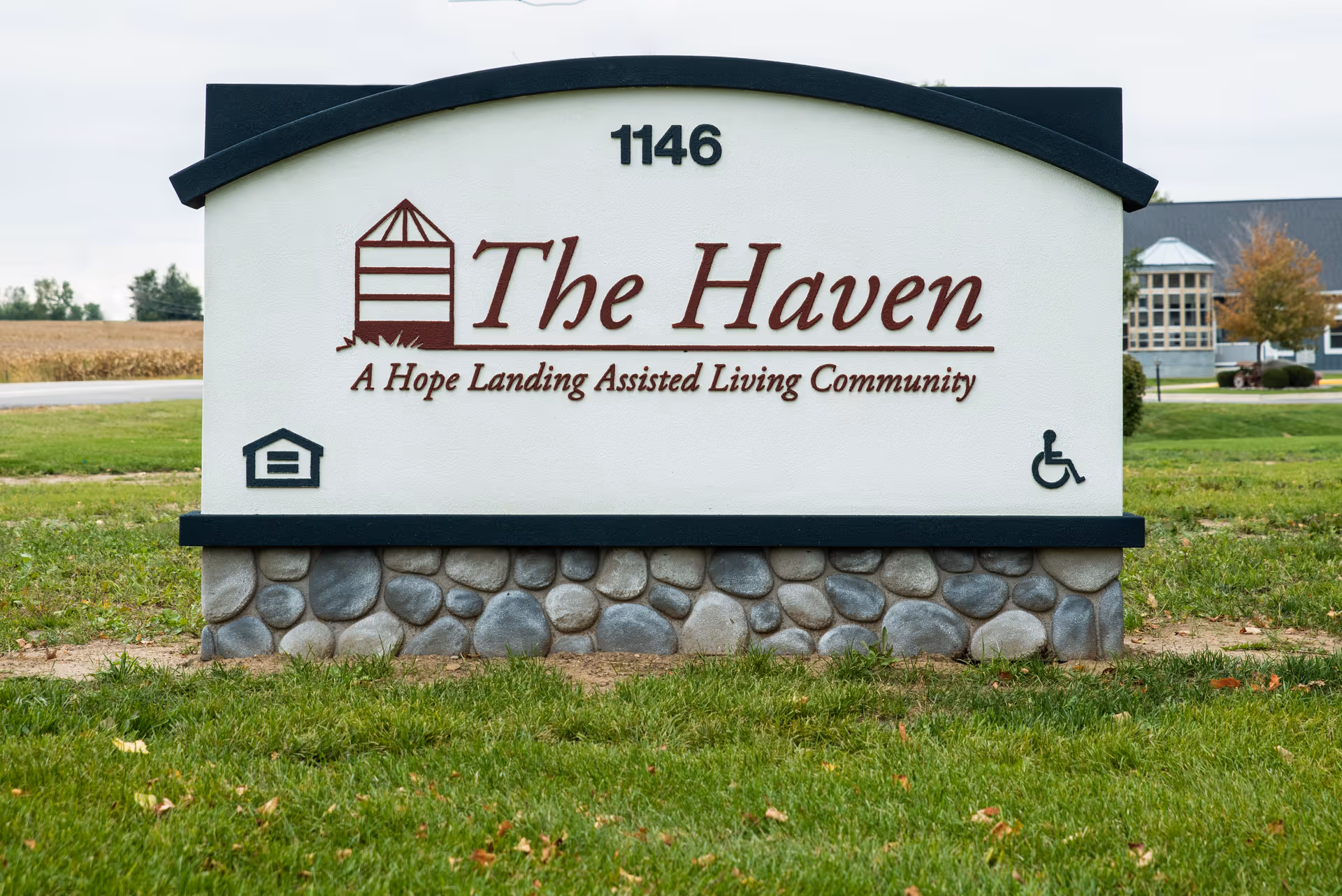 Sign for The Haven, a Hope Landing Assisted Living Community, displayed on a stone base.
