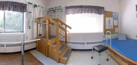 Pine Knoll Nursing Center rehab room with wooden climbing frame