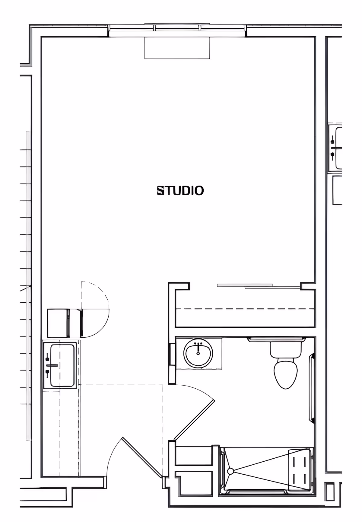 Black-and-white floor plan of a studio apartment showing a main studio area, kitchenette, bathroom with sink and toilet, and a small sleeping/closet area.