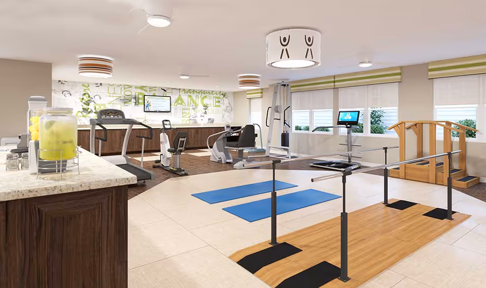Bright indoor exercise and therapy room with treadmills, strength machines, parallel bars, yoga mats, and a small refreshment counter.