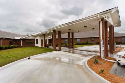 Exterior view of Renaissance Care Center showing a covered entrance and driveway.