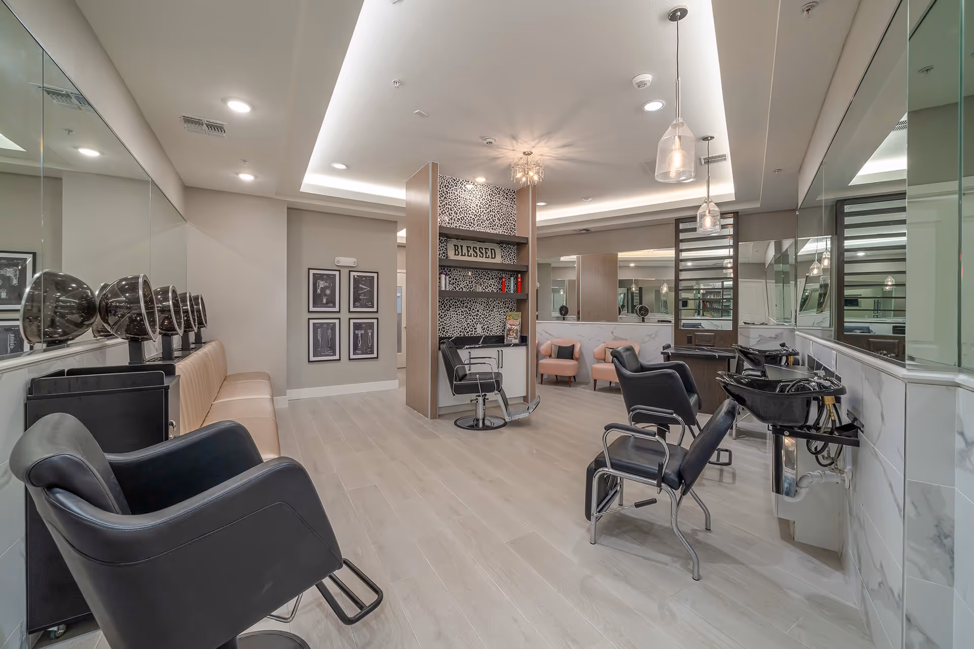 Well-lit salon interior with styling chairs, hair-washing sinks, large mirrors, and a seating area.