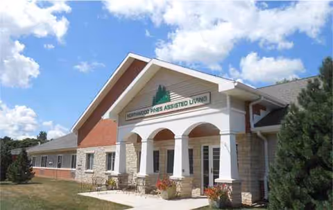 Exterior view of a Lutheran retirement facility with arched entrance and landscaped surroundings.