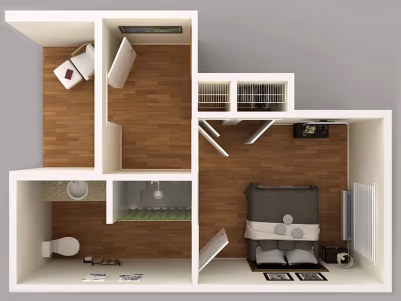 3D top-down rendered one-bedroom floor plan showing a bedroom with bed, a bathroom with toilet and sink, closets, and a small sitting area.