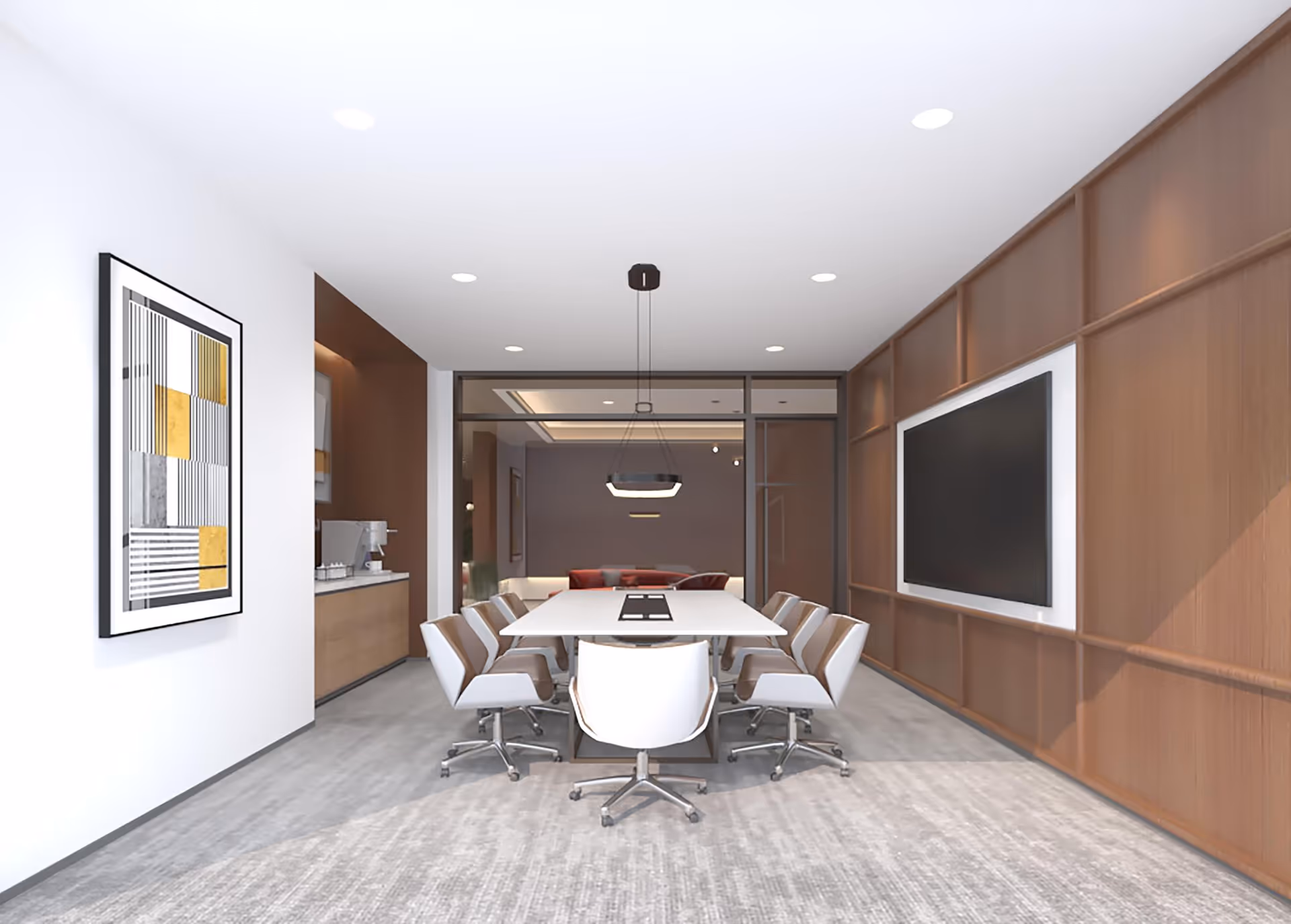 A modern conference room with a long white table surrounded by eight white swivel chairs. The room features a large flat-screen TV mounted on a wooden paneled wall, a contemporary hanging light fixture above the table, and a framed abstract artwork on a white wall. The floor is covered with a light gray carpet, and there is a small kitchenette area visible in the background.