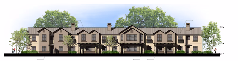 Architectural front elevation rendering of a two-story senior living building with gabled rooflines, balconies, windows and landscaped trees.