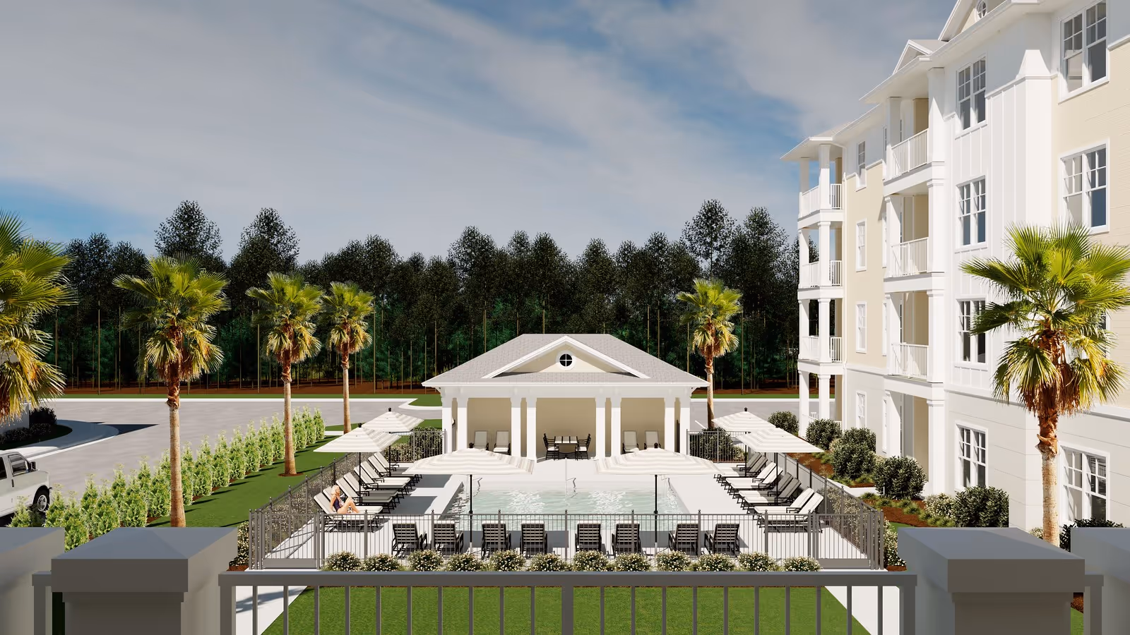 Outdoor pool courtyard with lounge chairs, a cabana, palm trees, and an adjacent multi-story white building.