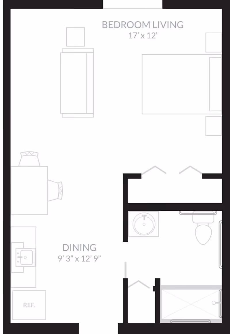 Floor plan layout showing a combined bedroom and living area measuring 17 feet by 12 feet, a dining area measuring 9 feet 3 inches by 12 feet 9 inches, a kitchen area with a refrigerator and sink, and a bathroom with a sink, toilet, and shower.