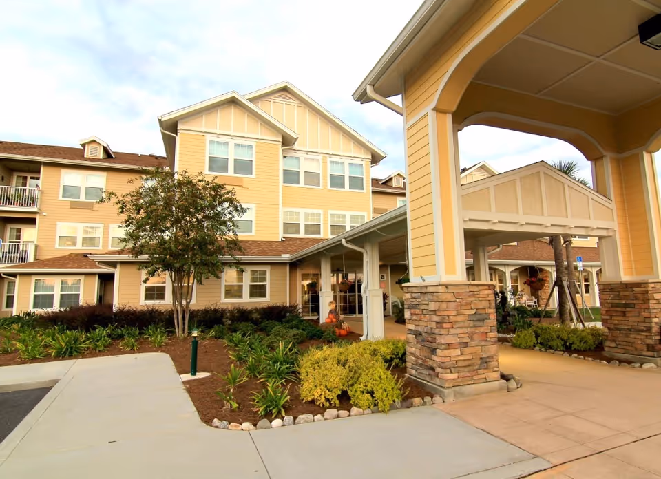 Front view of Steeplechase Gracious Retirement Living with a covered entrance and landscaped grounds.