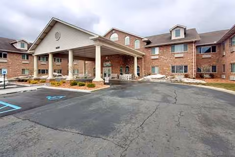 Brentwood at Hobart Senior Living exterior with a covered entrance and parking lot.