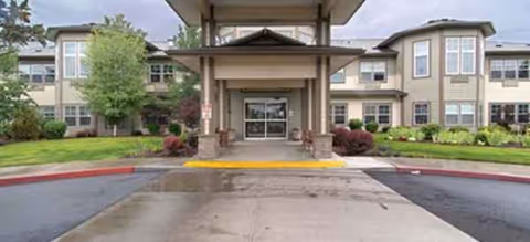 Front entrance of Brookdale Redmond senior living building with landscaping and driveway