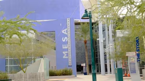 Front exterior of Avista Senior Living Downtown Mesa with blue wall and entrance.