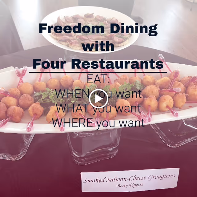 A serving tray with smoked salmon-cheese gougères garnished with parsley and accompanied by small berry pipettes, displayed on a table with a sign indicating the dish name. Text overlay reads 'Freedom Dining with Four Restaurants. EAT: WHEN you want, WHAT you want, WHERE you want.'
