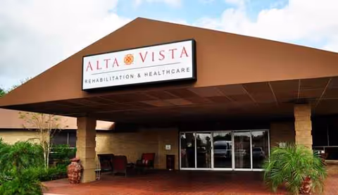 Front entrance of Alta Vista Rehabilitation and Healthcare building with a covered walkway.