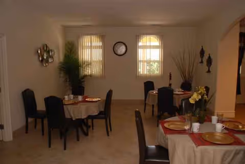 Virginia House dining room in a senior facility with tables set for meals and chairs.