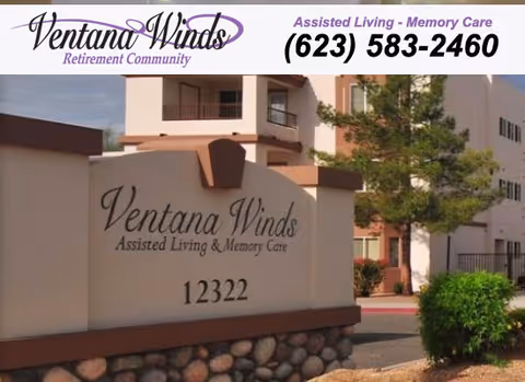 Entrance sign for Ventana Winds Assisted Living & Memory Care facility with the address 12322, in front of a multi-story building with balconies and surrounding greenery.