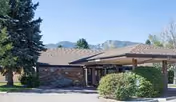 Front exterior of Mountain View Post Acute showing brick facade and a covered entrance.