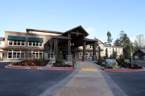 Exterior view of The Lodge at Mallard's Landing showing the entrance and landscaped approach.