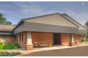 Front exterior view of Riverside Nursing Rehab building with brick walls and entryway.