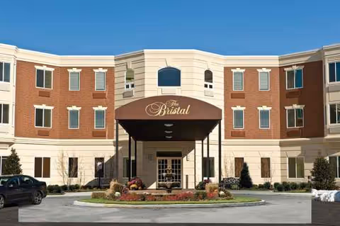 Front view of The Bristal Assisted Living at East Northport building with porte-cochere.