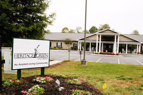 Heritage Green Assisted Living building exterior with sign and parking lot