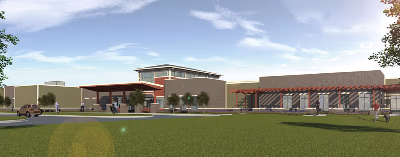 Exterior rendering of Wellbrooke of Kokomo showing the facility's front entrance, lawn, and a few people walking.