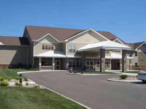 Exterior view of Primrose Retirement Community of Zanesville showing the entrance and driveway.