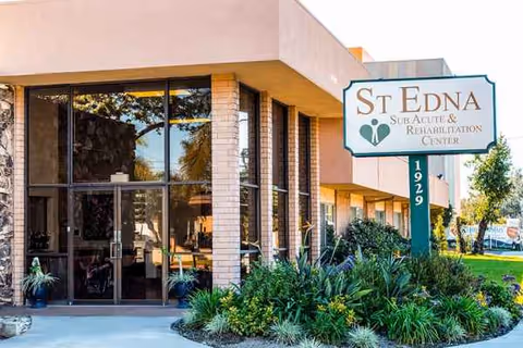 Exterior entrance of St Edna Sub-Acute and Rehabilitation Center with landscaped frontage.