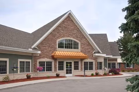 Front view of Medilodge of Midland showing brick exterior and entrance awning.